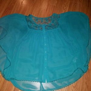 Blueish turquoise blouse.